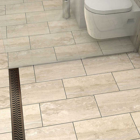 QuARTz Linear Shower Drain with Flag Grate - Oil Rubbed Bronze Installed in shower floor and toilet next to it