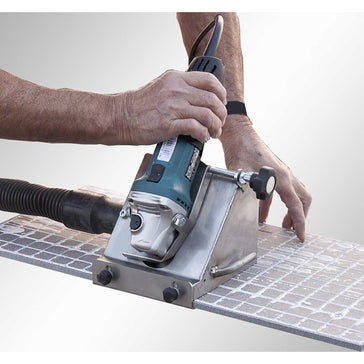 Person using a Rai Fix hook to install large format tile