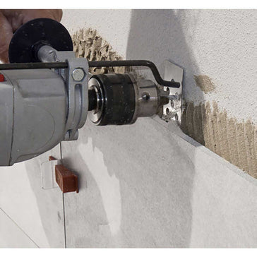 Person using a Rai Fix hook to install large format tile