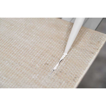 Person using a Rai Fix hook to install large format tile