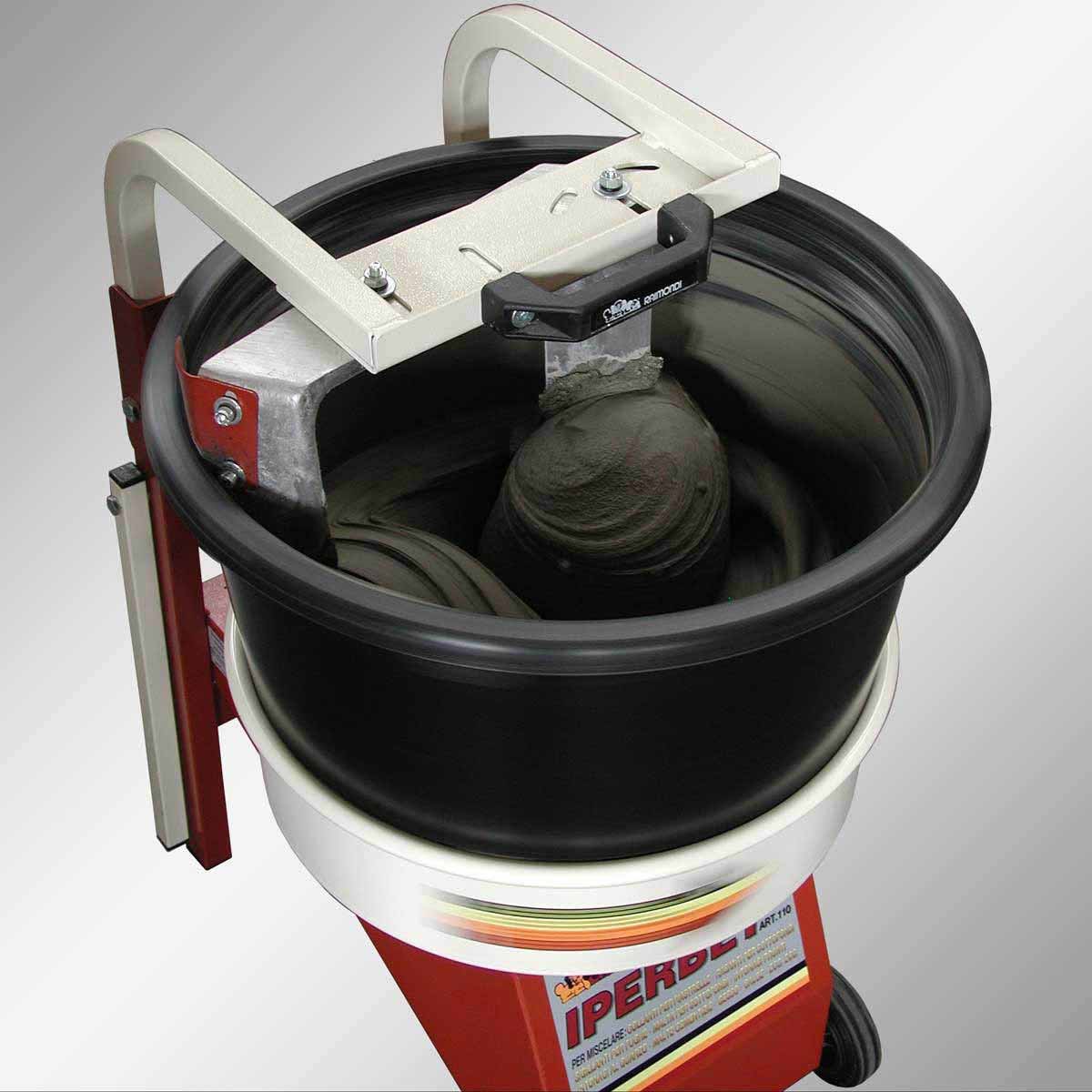 Contractor using Raimondi IPERBET rotating bucket mixer to prepare large batches of tile adhesive
