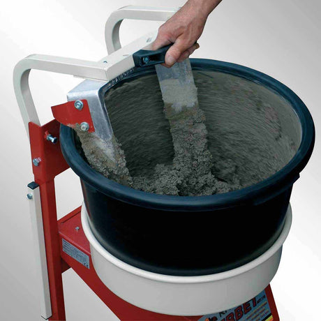 Construction crew mixing concrete and plaster materials with Raimondi IPERBET power mixer