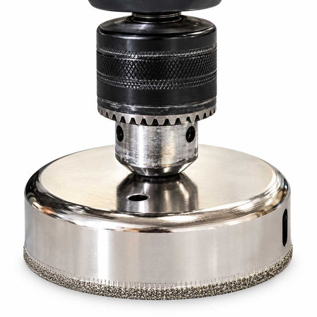 Raimondi Rai Bit Humid diamond core drill bit mounted in a drill chuck for wet tile drilling