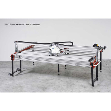 Workbench with extension table on a gray floor