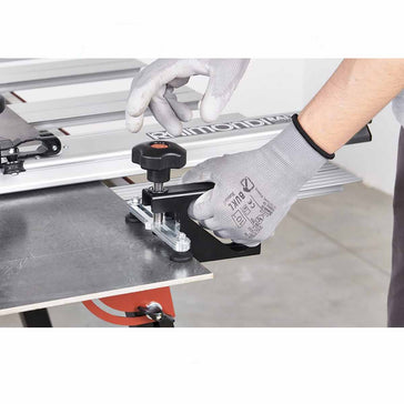 Person using Raimondi Raizor Cutting System 10 ft Scoring Guide Kit MKII Plus, wearing gloves.