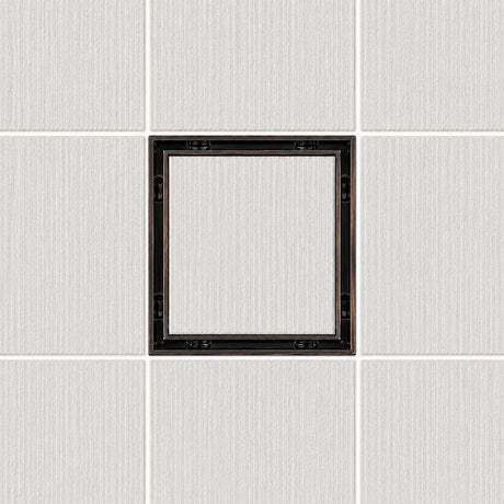 Serene Drains 5 inch square tile insert drain with ORB frame installed in a light tile surface"