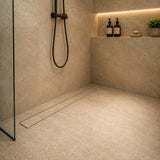 Oil rubbed bronze tile insert drain in a contemporary walk-in shower