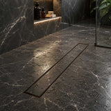 Oil rubbed bronze linear drain in an elegant bathroom shower design