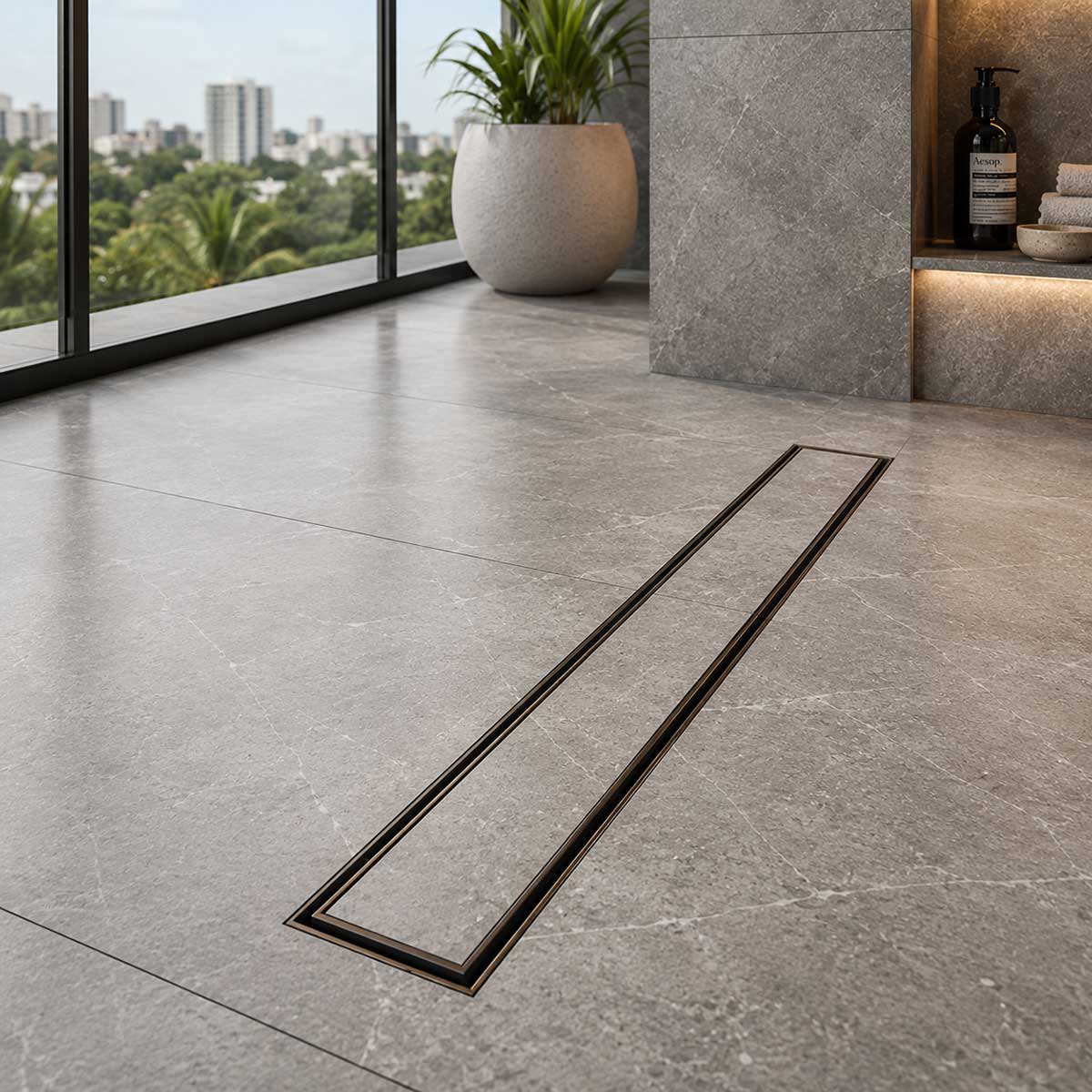 Oil rubbed bronze shower drain with modern tile flooring in a luxury bathroom