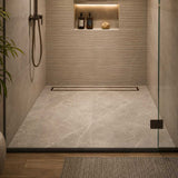 Oil rubbed bronze linear drain used in a stylish indoor Shower wet room