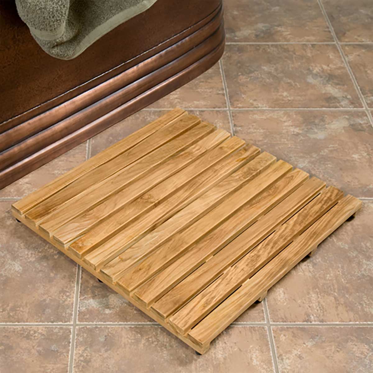 Serene teak wood mat beside freestanding bathtub