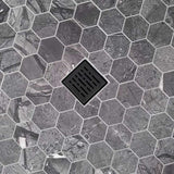 Hexagonal stone pavement with a central drain cover