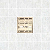 Decorative square shower drain cover with a textured pattern on a white background
