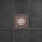 Serene Square Drain in Bronze over porcelain tile floor