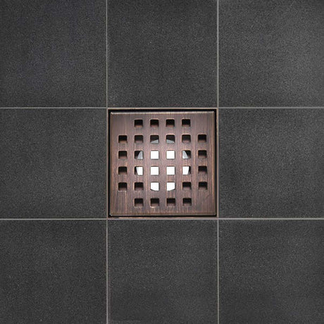 Serene Square Drain in Bronze over porcelain tile floor