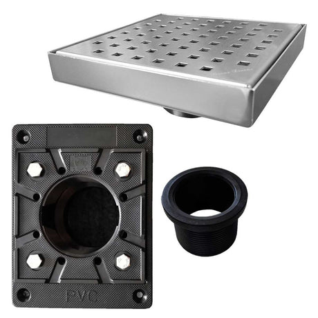 Collection of drain components including a metal grid, PVC fitting, and black rubber washer on a white background.