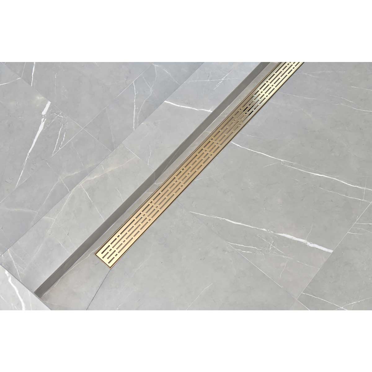 SereneDrain broken lane in Satin gold finish installed in shower over grey tile