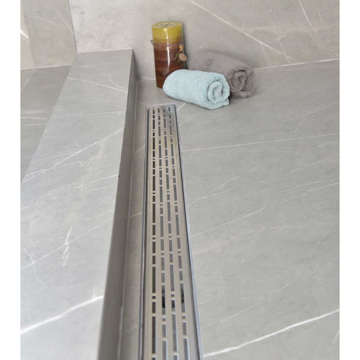 SereneDrains installed in a grey porcelain tile