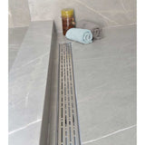 SereneDrains installed in a grey porcelain tile