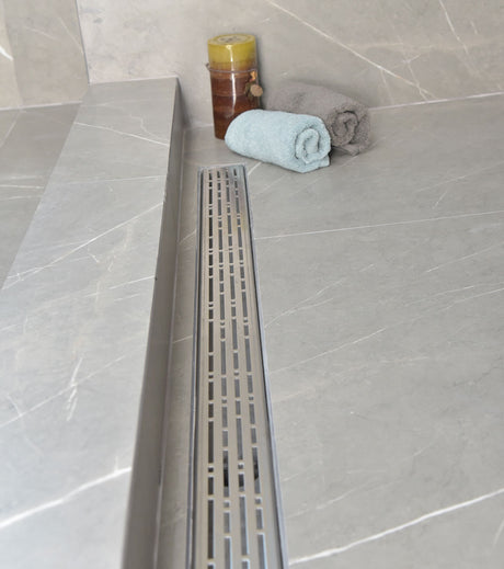 SereneDrains installed in a grey porcelain tile
