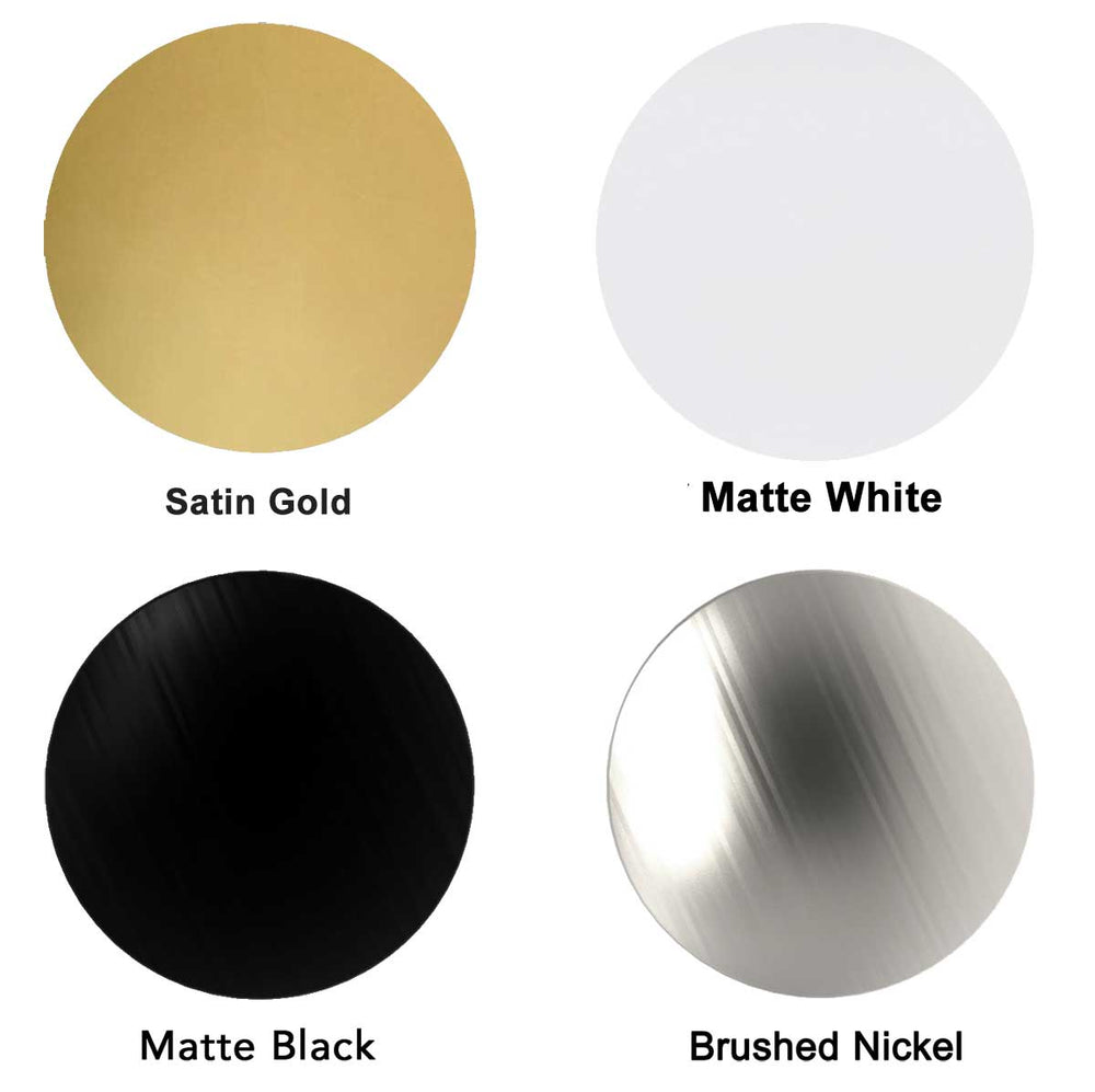 Four circular metal samples in different finishes on a white background