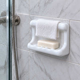 SereneDrains ceramic wash cloth soap dish close-up with wash cloth bar and soap in shower