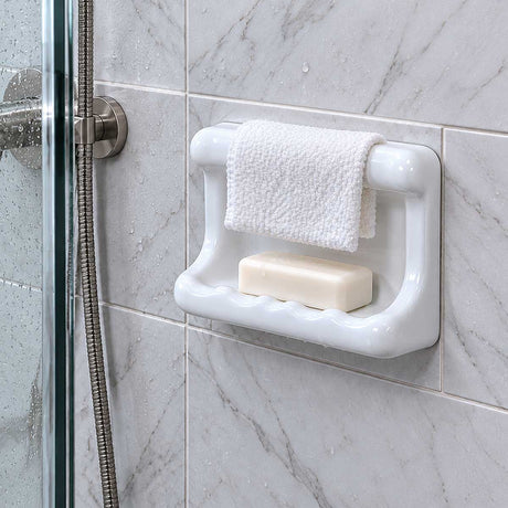 SereneDrains ceramic wash cloth soap dish close-up with wash cloth bar and soap in shower