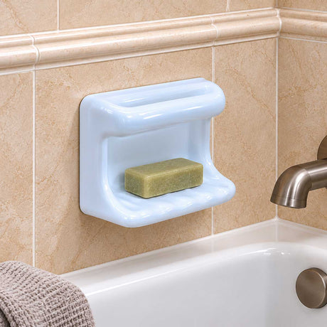 SereneDrains ceramic wash cloth soap dish close-up with wash cloth bar and soap above bathtub