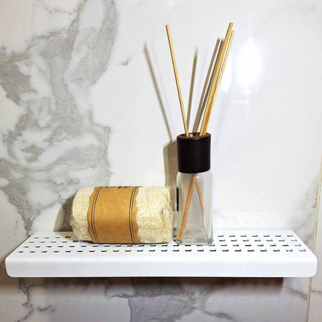 Serene Matte White Rectangle stainless steel shower shelf in a modern marble shower
