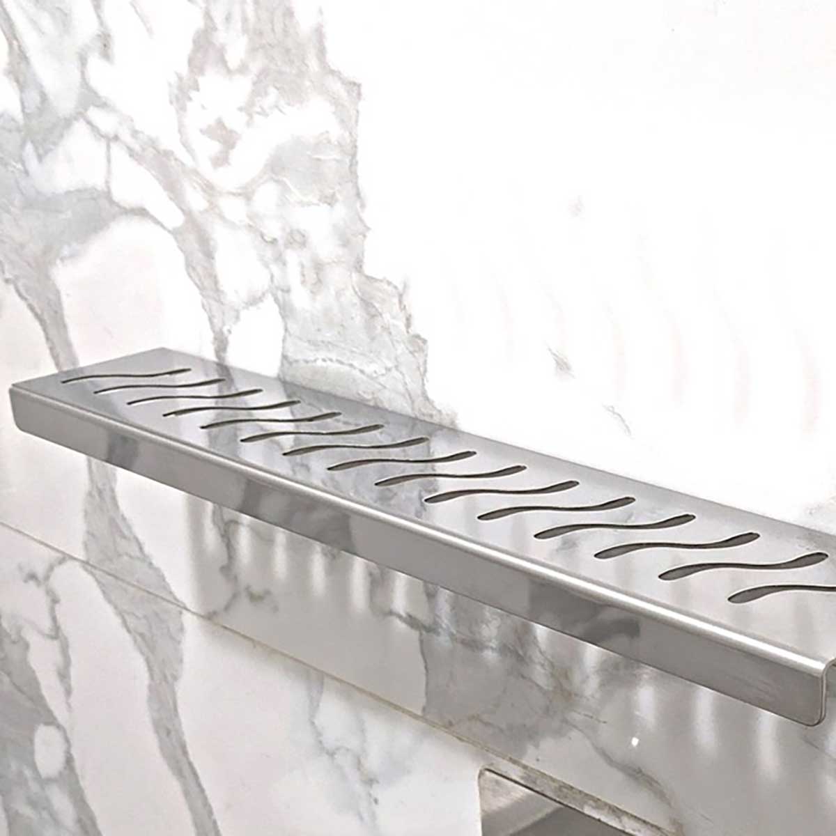 SereneDrains Ocean Wave shower shelf with brushed stainless finish