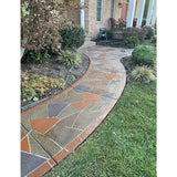 Smith Paint sealer over concrete floor design as a Decorative stone pathway leading to a house with garden plants on either side.
