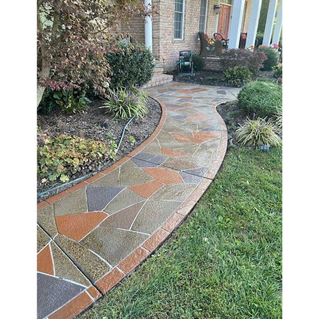 Smith Paint sealer over concrete floor design as a Decorative stone pathway leading to a house with garden plants on either side.
