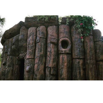 Wooden log structure with natural texture and plants on top applied with Smith Paint Poly-SB