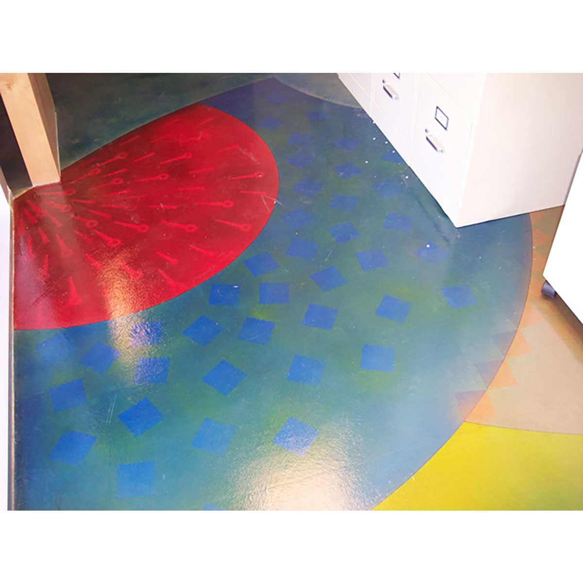 Colorful abstract pattern on a textured surface using Smiths Paint Concrete Color Stains