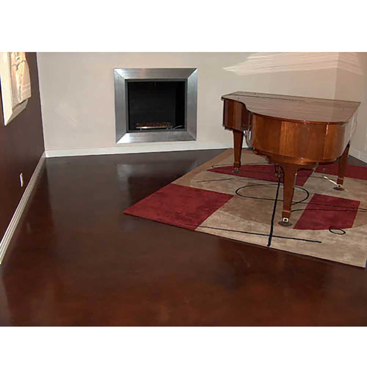 Wooden grand piano in a room with a fireplace and rug