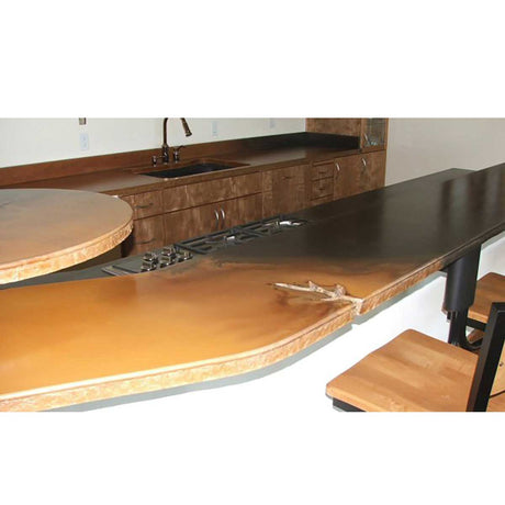 Wooden kitchen island with a black countertop, sink, and stove.