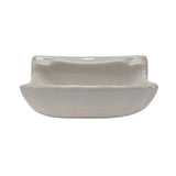 Small biscuit glossy porcelain soap dish shell for tiled shower and bathroom walls.