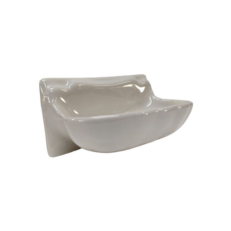 Porcelain soap and shampoo dish integrated into a tile shower surround.