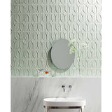 Bathroom with Takao Magnolia 3x6 3D Matte Porcelain Wall Tile and a round mirror.