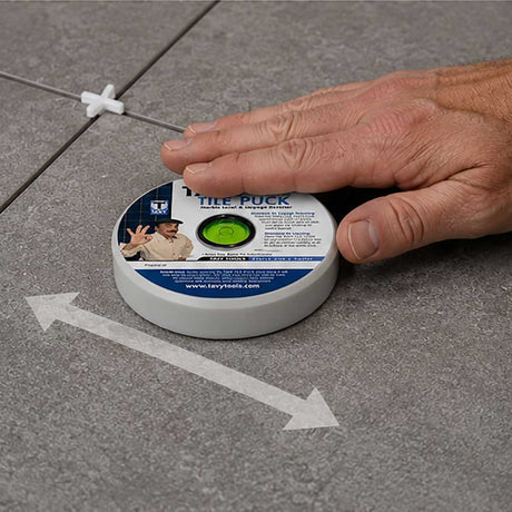 Using the TAVY Tile Puck to detect tile lippage and high spots during professional tile installation