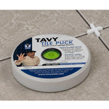 TAVY Tile Puck marble level and lippage detector placed on a porcelain tile floor during tile installation