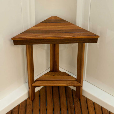 Mini teak corner bench installed in small shower