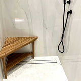 Teak corner bench in luxury spa bathroom