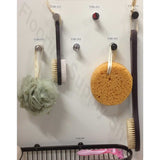Tileware Promessa Series Hooks with various hanging items such as cleaning tools including a scrub brush, sponge, and loofah