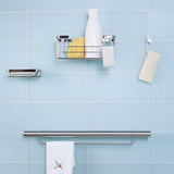 TileWare Promessa Rectangular Soap Basket with Towel bar on a blue tile wall
