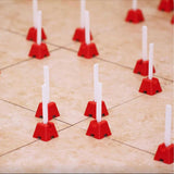 Professional installer using the Tuscan Tile Leveling System during a large format tile installation