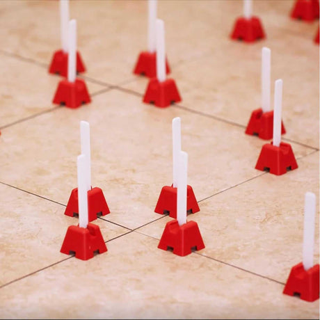 Professional installer using the Tuscan Tile Leveling System during a large format tile installation