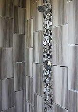 Decorative aluminum and glass backsplash tile installation