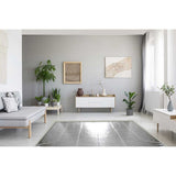 Modern living room with gray walls, white furniture, and Warmup Foil Radiant Heating System 
