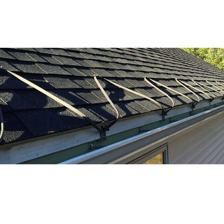 Gutter system on a roof with visible rain gutters and downspouts.